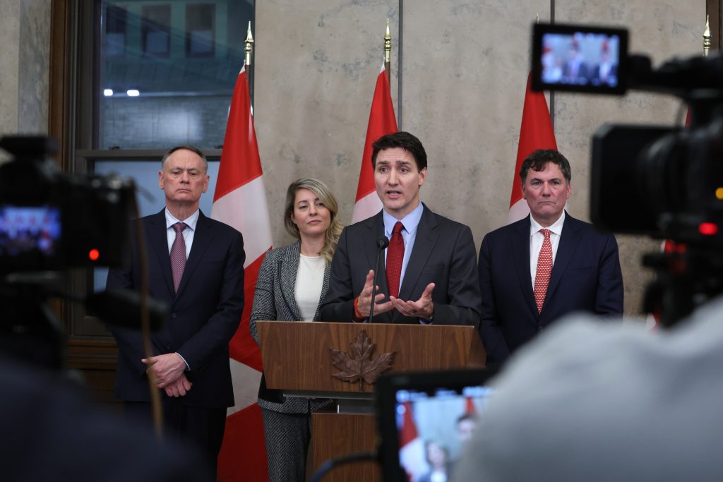 Justin Trudeau, Canada's prime minister (centre), speaks during a press conference, on 1 February 2025. Credit: David Kawai/Bloomberg via Getty Images